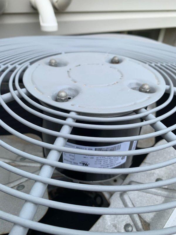 Replaced defective condenser fan motor and run capacitor on second floor air conditioning system. Removed failed components and installed new CFM with protective wire guard and matching capacitor to restore proper unit operation. Tested system operation and confirmed equipment running within normal parameters upon completion.