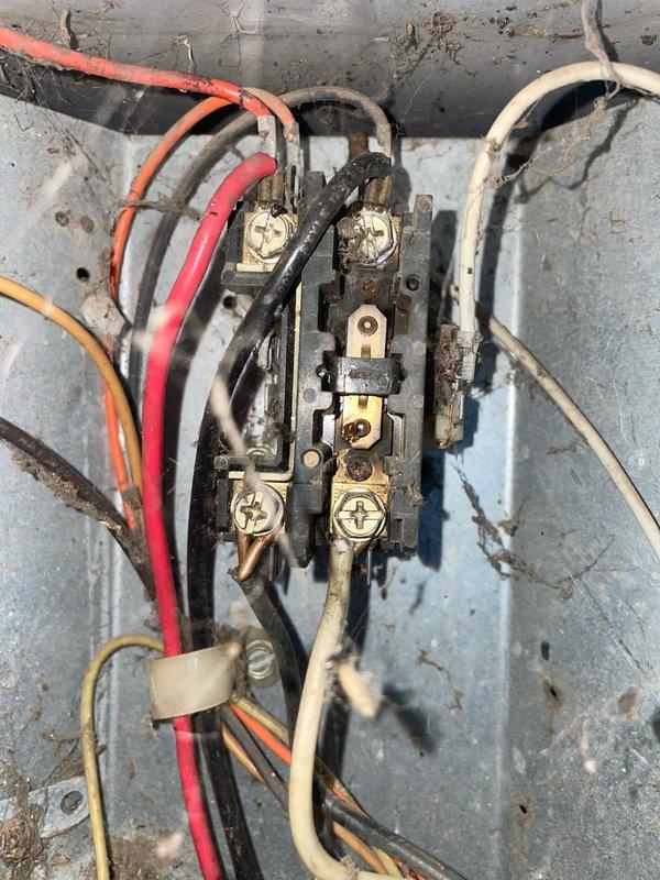 Responded to no cooling call on 10+ year old air conditioning system. Upon arrival, found thermostat set to cool mode at 78°F but unit producing only ambient air with no temperature drop. Performed diagnostic evaluation of system components including thermostat functionality and electrical connections at air handler terminal block. Inspected wiring integrity and terminal connections, noting age-related deterioration of equipment. Identified root cause of cooling failure and completed necessary repairs to restore proper system operation. Unit tested and verified cooling cycle functioning correctly upon departure.