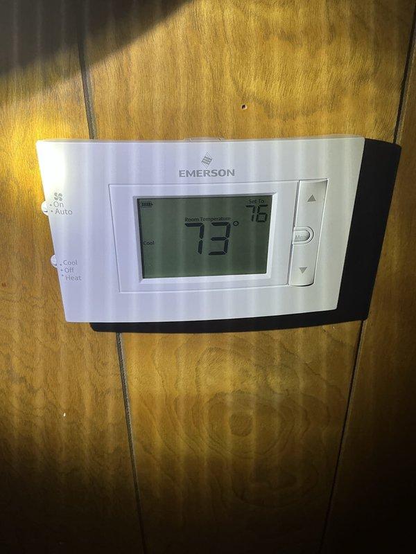 Completed comprehensive cooling system tune-up on 10-year-old outdoor unit located in side yard. Performed standard maintenance protocol including filter inspection, thermostat verification showing proper operation in auto mode at 75-degree setpoint, and interior component assessment. Noted debris accumulation in drain pan area that was addressed during service, and confirmed airflow direction markings and mesh filter condition satisfactory for continued operation.