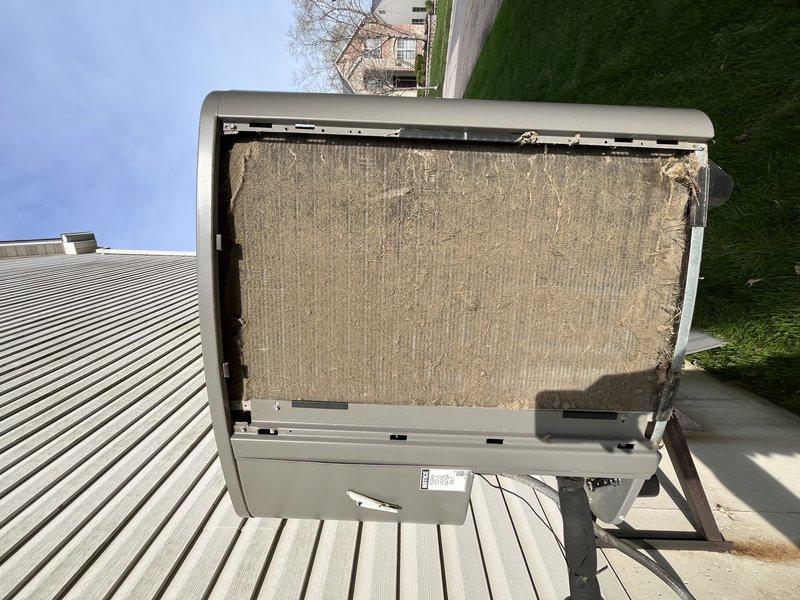 Completed preventive maintenance tune-up on two elevated outdoor HVAC condensing units requiring stepladder access. Performed comprehensive inspection of both systems, documenting unit conditions with photographic evidence showing accumulated debris on heat exchanger coils and deteriorated filter media with visible tearing and separation from frame. Cleaned condenser coils, addressed filtration concerns, and verified proper system operation on both units.