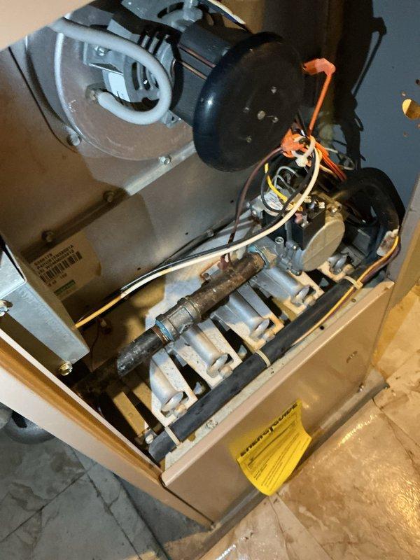 Completed repair on residential heating unit by replacing corroded gas valve shut-off with new assembly, installing union fitting for improved serviceability, and adding drip leg to gas line per code requirements. Removed deteriorated components showing significant rust and oxidation, ensuring proper gas flow and safety compliance. Unit tested and restored to full operational status with heating function confirmed.