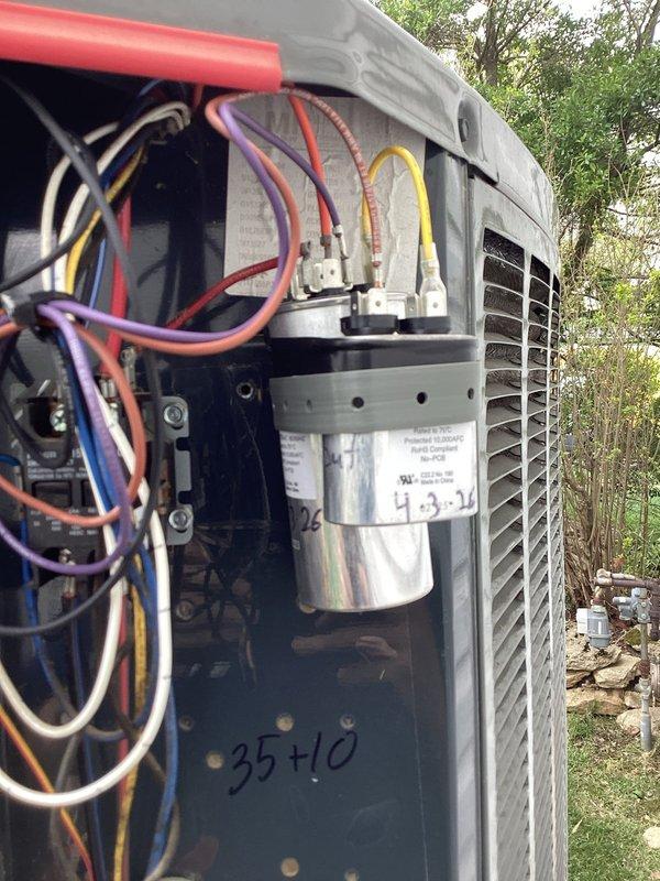 Replaced defective condenser fan motor (CFM) on outdoor HVAC unit serial number 17284mfy2f. Accessed electrical compartment, disconnected existing motor wiring from dual-run capacitor (35+10 MFD), removed failed motor assembly, and installed warranty replacement unit. Verified proper electrical connections, tested fan operation, and confirmed system functionality in both heating and cooling modes.