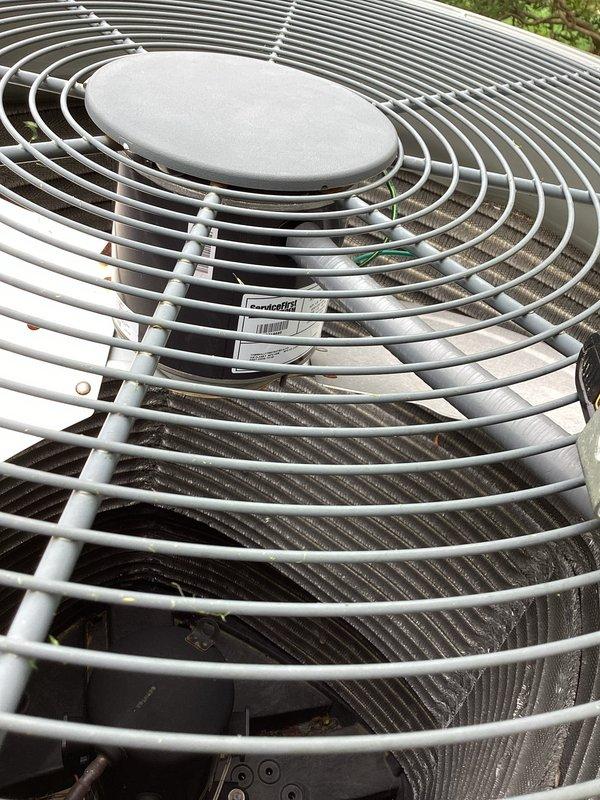 Replaced defective condenser fan motor (CFM) on outdoor HVAC unit serial number 17284mfy2f. Accessed electrical compartment, disconnected existing motor wiring from dual-run capacitor (35+10 MFD), removed failed motor assembly, and installed warranty replacement unit. Verified proper electrical connections, tested fan operation, and confirmed system functionality in both heating and cooling modes.