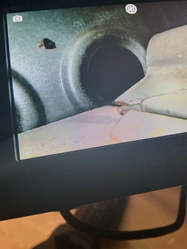 Performed heat exchanger inspection on 30-year-old furnace unit as requested. Visual examination revealed significant rust staining and corrosion on heat exchanger surfaces, with visible water damage patterns indicating potential metal deterioration. Documented findings with photographic evidence of affected components for review and recommended evaluation for replacement due to age and condition of unit.