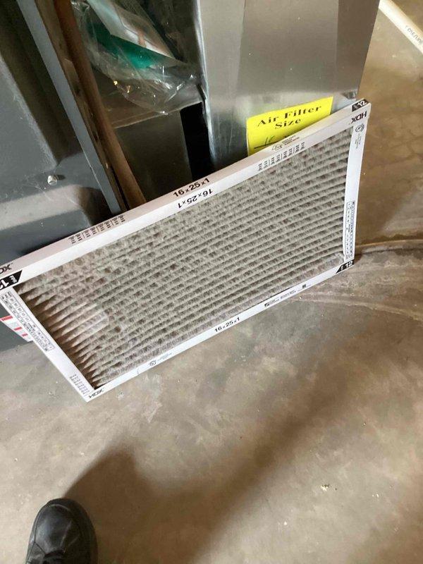 # HVAC Cooling System Tune-Up Completed

Performed seasonal cooling maintenance on a 10-year-old residential air conditioning unit located at side of house. Conducted comprehensive system inspection including airflow assessment, electrical measurements, and filter evaluation. Replaced dirty air filter (16x25x1) that showed significant dust and debris accumulation. Measured operating amperage at 0.54A using digital clamp meter to verify compressor performance within manufacturer specifications. Verified all electrical connections, tested system controls, and confirmed proper unit operation. System is functioning efficiently and ready for cooling season.