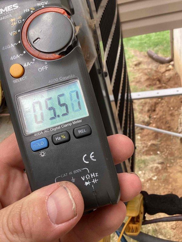 # HVAC Cooling System Tune-Up Completed

Performed seasonal cooling maintenance on a 10-year-old residential air conditioning unit located at side of house. Conducted comprehensive system inspection including airflow assessment, electrical measurements, and filter evaluation. Replaced dirty air filter (16x25x1) that showed significant dust and debris accumulation. Measured operating amperage at 0.54A using digital clamp meter to verify compressor performance within manufacturer specifications. Verified all electrical connections, tested system controls, and confirmed proper unit operation. System is functioning efficiently and ready for cooling season.