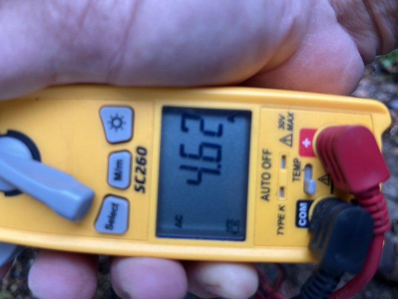 Responded to no cooling call on 9-year-old air conditioning system where indoor blower was operating but outdoor unit failed to run. Upon arrival, performed diagnostic testing and measured voltage at outdoor unit using digital multimeter, which revealed electrical issue preventing compressor operation. Inspected attic-mounted air handler and associated refrigerant lines, ductwork, and electrical connections. Identified failed capacitor as root cause of outdoor unit failure. Replaced defective dual run capacitor with manufacturer-specified component, restoring power to compressor and condenser fan motor. Verified proper voltage readings, confirmed outdoor unit operation, and tested system performance. System now cooling properly with both indoor and outdoor units functioning as designed.