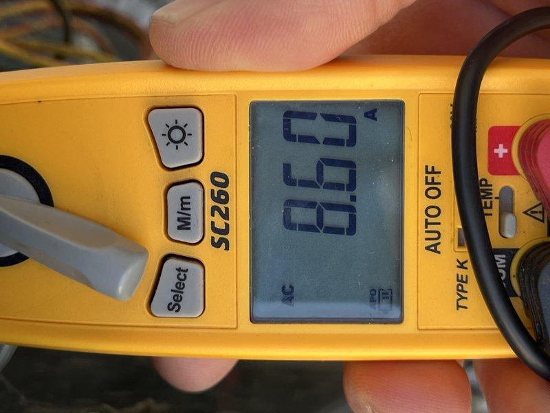 Completed seasonal cooling tune-up on 12-year-old residential air conditioning unit located at side of house. Performed comprehensive system diagnostics using digital multimeter to verify electrical readings and temperature measurements, confirming all components operating within normal parameters.