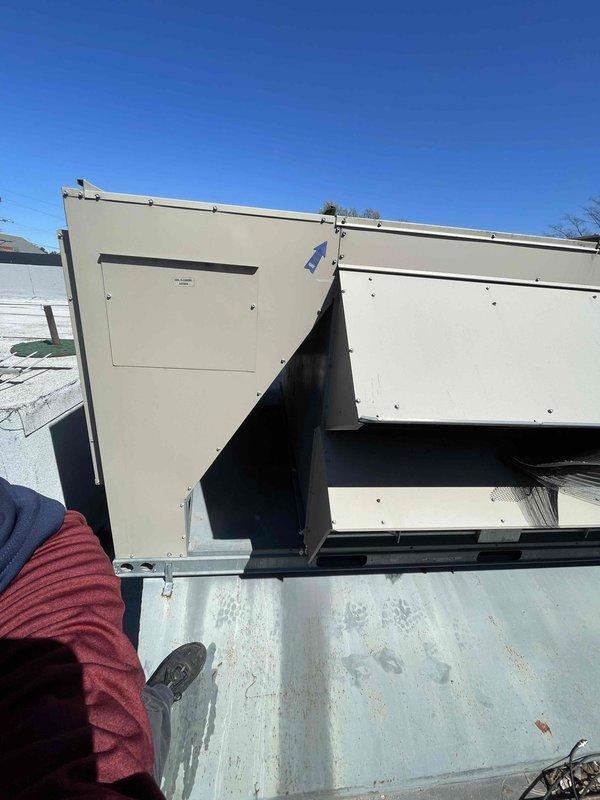 Responded to callback for excessive vibration in rooftop HVAC unit serving dining room area, which was causing structural shaking severe enough to break glassware following recent maintenance. Upon inspection, discovered deteriorated and corroded mounting shaft on unit support assembly. The cylindrical mounting rod exhibited significant rust and oxidation, compromising the structural integrity of the isolation mount. Replaced failed mounting bracket assembly and corroded shaft with new hardware to restore proper vibration isolation. Verified all mounting bolts were properly torqued and unit was securely fastened to roof curb. Cycled unit through full operation and confirmed vibration levels returned to normal specifications with no excessive movement transmitted to building structure.