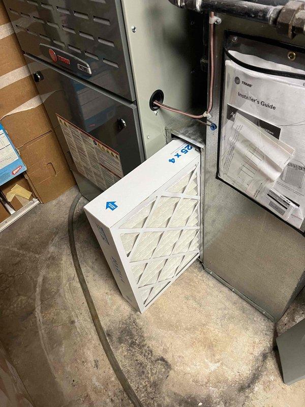 Completed preventative maintenance cooling inspection on 5-year-old residential outdoor unit. Performed comprehensive system evaluation including electrical diagnostics using clamp meter to verify amperage draw on refrigerant lines and confirmed proper electrical operation. Inspected indoor furnace system and replaced air filters with new pleated media filters, ensuring correct airflow direction and proper fit. Verified all system components operating within manufacturer specifications. Discussed and processed preventative maintenance agreement renewal on-site.