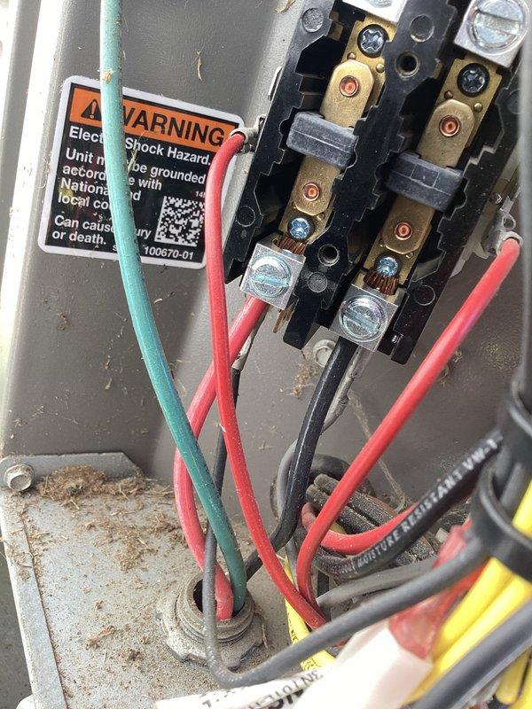 Responded to no-cool call on 7-year-old AC system where outdoor unit failed to operate while indoor unit ran normally. Upon arrival, performed diagnostic testing using refrigerant manifold gauges to assess system pressures and temperatures. Inspection revealed electrical issue at outdoor disconnect box with compromised wiring connections. Examined terminal blocks and found loose or damaged connections affecting power delivery to condensing unit. Repaired electrical connections, secured all terminal blocks, and verified proper voltage supply to outdoor unit. System restored to normal operation with outdoor unit engaging properly and delivering adequate cooling performance.