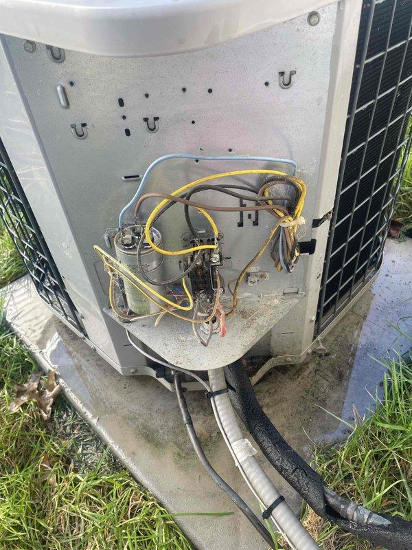 Completed comprehensive cooling maintenance on 15-year-old Trane air conditioning system. Performed full system inspection including electrical connections, capacitor testing, refrigerant line examination, and component evaluation. Accessed outdoor unit service compartment, inspected compressor, verified all refrigerant connections and insulation integrity on copper lines. Checked capacitor function and electrical wiring connections throughout control panel. Cleaned debris accumulation from interior compartment and exterior surfaces. All components tested and operating within normal parameters; system confirmed cooling properly with no immediate service needs identified.