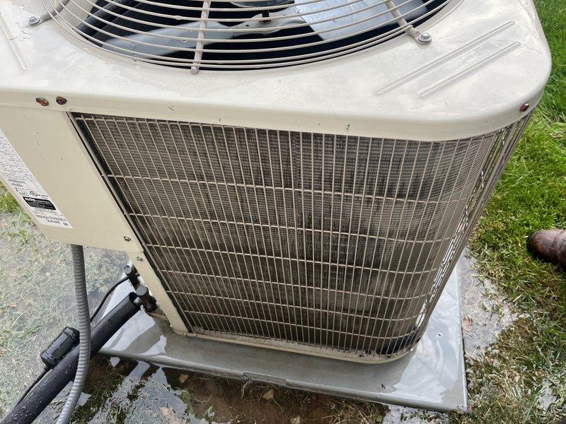 Completed comprehensive cooling season tune-up on single outdoor condensing unit. Performed standard maintenance protocol including inspection of condenser coils, which showed moderate accumulation of debris and dust requiring attention, verified fan operation and electrical connections, and documented unit condition with photographs. System operational upon completion with recommendations provided for ongoing maintenance.