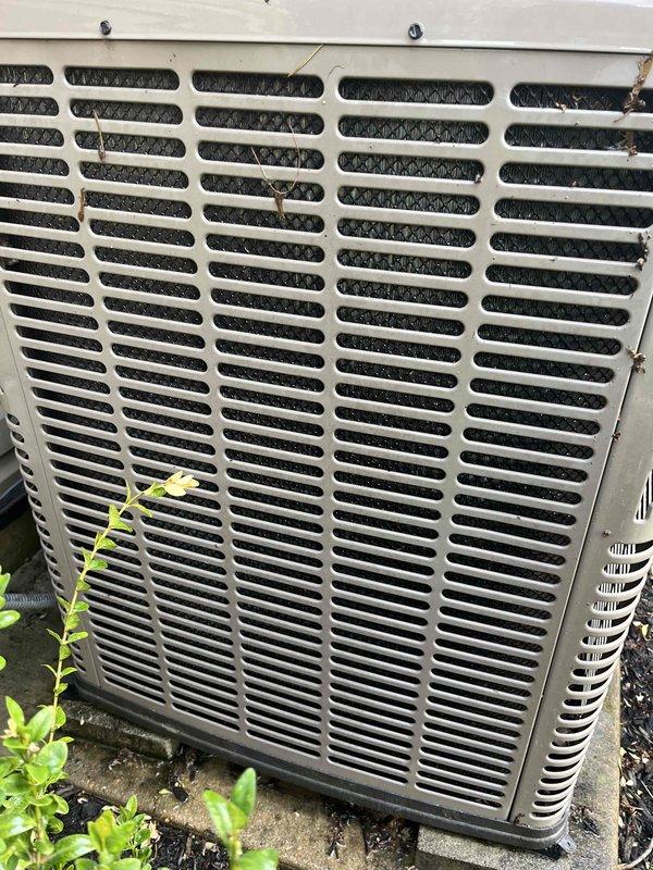 Completed preventive maintenance tune-up on single ground-level residential air conditioning unit. Performed comprehensive system inspection, cleaned condenser coil fins which showed significant accumulation of dirt and outdoor debris, checked refrigerant levels, tested electrical connections, and verified proper airflow through exterior grille. Unit returned to normal operating condition with improved efficiency after cleaning and standard maintenance procedures.