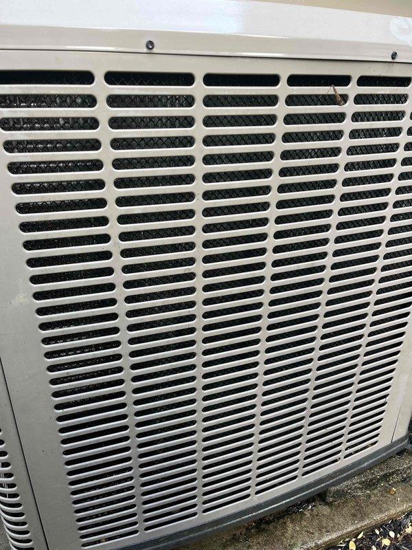 Completed preventive maintenance tune-up on single ground-level residential air conditioning unit. Performed comprehensive system inspection, cleaned condenser coil fins which showed significant accumulation of dirt and outdoor debris, checked refrigerant levels, tested electrical connections, and verified proper airflow through exterior grille. Unit returned to normal operating condition with improved efficiency after cleaning and standard maintenance procedures.