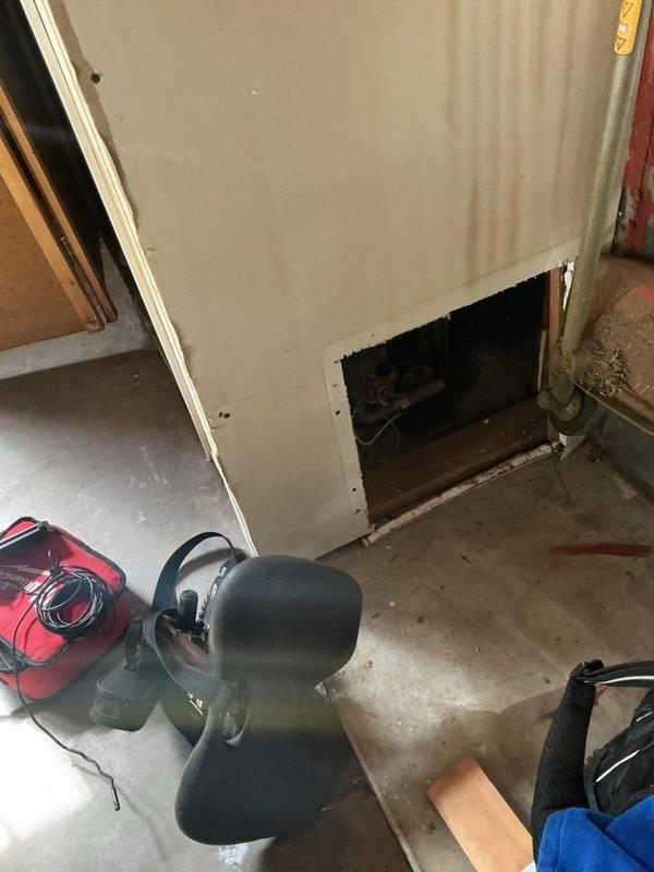 Responded to service call for older boiler unit located in garage experiencing leaking and overheating issues. Upon arrival, conducted thorough inspection of boiler system and surrounding mechanical equipment in utility space. Assessed visible piping, connections, and mechanical components to identify source of water leak and determine cause of overheating condition. Documented equipment condition and workspace setup for service records.