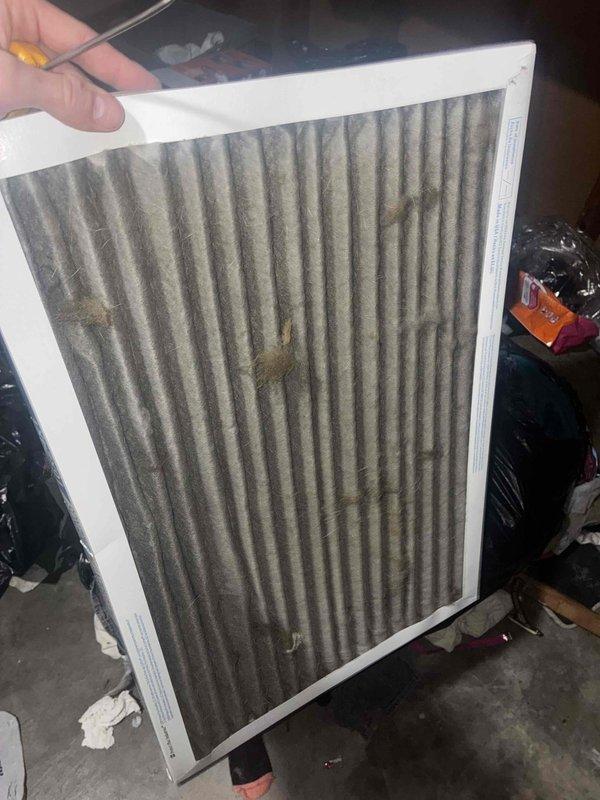 Completed cooling system tune-up on Goodman air conditioning unit located in backyard. Unit showed significant debris accumulation on condenser coils and fins, which was cleaned to restore proper airflow and heat transfer efficiency. Inspected and replaced dirty air filter to improve indoor air quality and system performance.