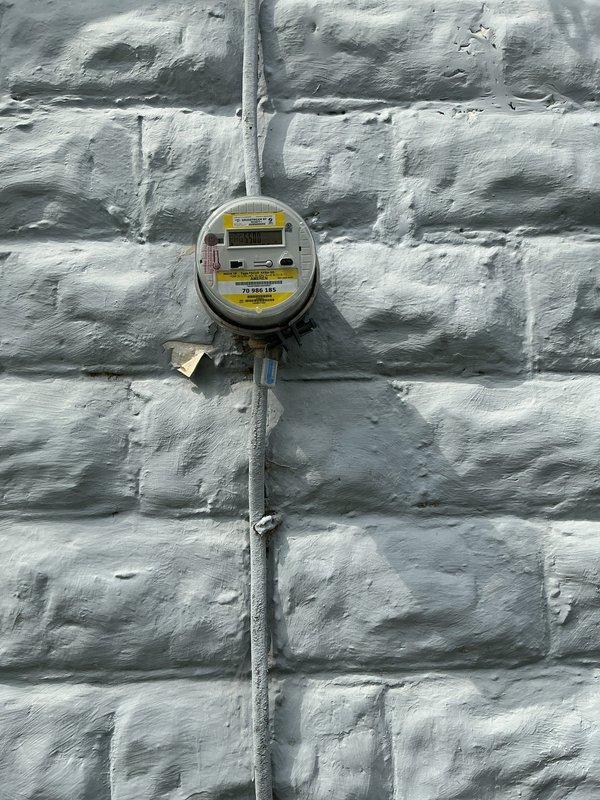 Conducted on-site electrical assessment for installation of dedicated 240-volt circuit to support new air conditioning system. Evaluated existing electrical service at meter base and main distribution panel to verify adequate capacity and determine optimal routing for new circuit. Documented current panel configuration showing available breaker spaces and confirmed compatibility for required double-pole breaker installation to accommodate AC unit electrical requirements.