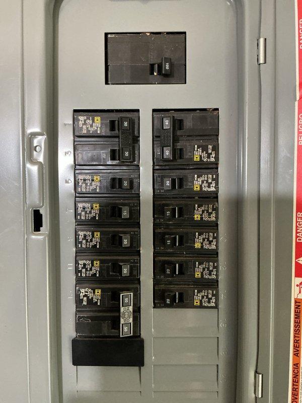 Conducted on-site electrical assessment for installation of dedicated 240-volt circuit to support new air conditioning system. Evaluated existing electrical service at meter base and main distribution panel to verify adequate capacity and determine optimal routing for new circuit. Documented current panel configuration showing available breaker spaces and confirmed compatibility for required double-pole breaker installation to accommodate AC unit electrical requirements.