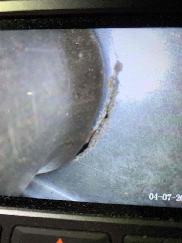 Responded to no heat call for furnace running continuously but blowing only cold air. Upon inspection of the 10+ year old basement unit, utilized camera inspection equipment to examine the heat exchanger and discovered significant deterioration and debris accumulation within the system. Found compromised heat exchanger with visible material breakdown and blockage affecting proper heat transfer and airflow. Documented findings with photographic evidence showing internal ductwork condition and heat exchanger damage. Advised on necessary repairs to restore heating function and ensure safe operation of the furnace system.