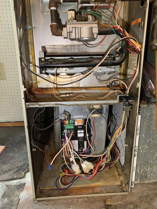 Completed comprehensive tune-up and maintenance service on residential gas furnace system. Performed thorough inspection of all internal components including gas valve assembly, burner assembly, heat exchanger, and blower motor. Checked and tested all electrical connections, control board functionality, and safety switches for proper operation. Inspected wiring harnesses and connections throughout the unit, verifying secure terminations and proper voltage levels. Examined burner flames for proper ignition sequence and combustion characteristics. Cleaned burner assembly and verified gas pressure at manifold. Tested limit switches and flame sensor operation. Inspected heat exchanger for cracks or signs of deterioration. Checked blower motor amperage and lubricated as needed. Verified proper airflow through the system and inspected filter condition. Tested thermostat operation and system cycling. All components found to be functioning within manufacturer specifications. System operating s
