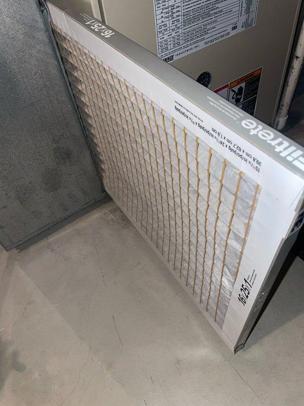 Completed comprehensive cooling tune-up service on two residential HVAC units located in side yard (one unit over one year old, one unit under one year old). Performed standard U10 maintenance protocol on both systems, including inspection of air handlers, verification of refrigerant levels, electrical connections check, and condenser coil assessment. Inspected and documented air filtration systems on both units, noting pleated filters with cardboard frames installed in furnace/air handler compartments. Both systems operating within normal parameters upon completion of tune-up service.