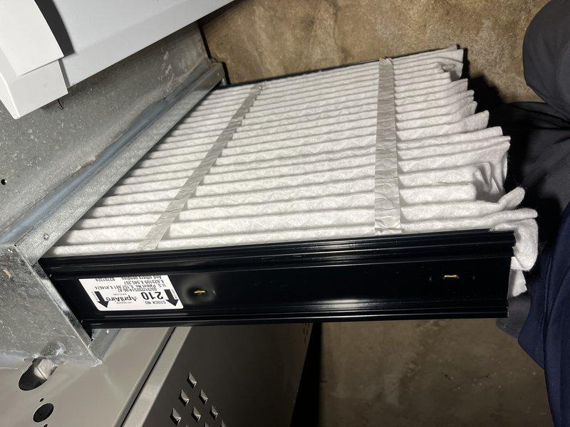Responded to no heat call on 2022 Lennox furnace unit. Upon inspection, discovered dirty air filter restricting airflow and potential flame sensor contamination indicated by oil residue on blower housing components. Cleaned flame sensor, replaced air filter, and verified proper system operation with unit cycling normally and producing heat.