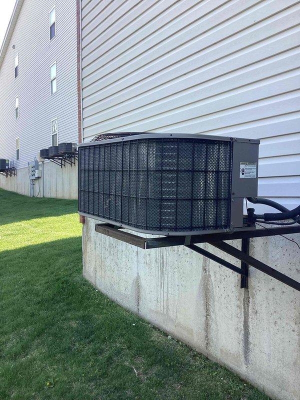 Completed comprehensive cooling maintenance on 20-year-old York air conditioning system. Performed standard tune-up procedures including inspection of outdoor condensing unit, verification of proper installation on concrete pad and wooden platform, checked electrical connections and refrigerant levels, replaced air filter, and confirmed system operational status. All components functioning properly with no issues identified during service visit.