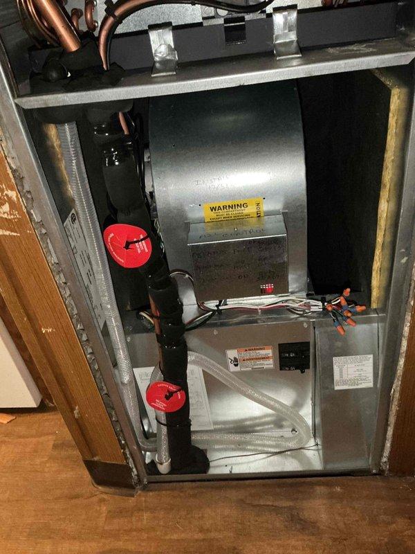 Responded to service call for residential A/C unit not maintaining setpoint temperature on system less than one year old. Upon arrival, performed comprehensive system inspection including visual examination of indoor air handler and evaporator coil assembly. Verified proper installation of 16x20x1 air filter and confirmed adequate airflow through evaporator coil. Inspected refrigerant line set connections, copper piping configuration, and coil condition for any signs of restriction, leakage, or mechanical issues. Checked electrical connections, wire terminations, and safety controls. Documented system components including blower assembly, ductwork connections, and overall installation quality. System evaluated for proper refrigerant charge, airflow balance, and operational performance to identify root cause of inadequate cooling capacity.