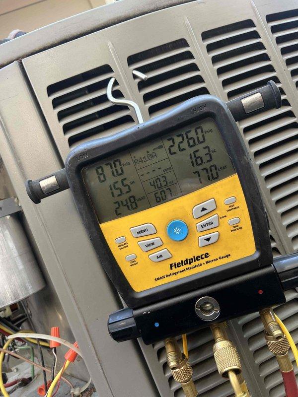 Completed comprehensive cooling tune-up on 17-year-old outdoor AC unit, including full system diagnostics with digital manifold gauges showing operational pressures and temperatures within acceptable parameters. Performed visual inspection of condenser coils, fan assembly, and electrical components; documented system condition with photos for service records.