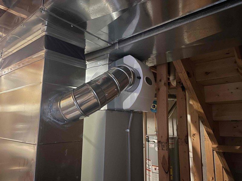 Completed installation of 600M whole-home humidifier unit integrated with existing HVAC ductwork system. Connected humidifier to water supply line using copper piping with appropriate fittings and mounted unit to main supply plenum. Verified proper operation of heating and cooling system following installation.