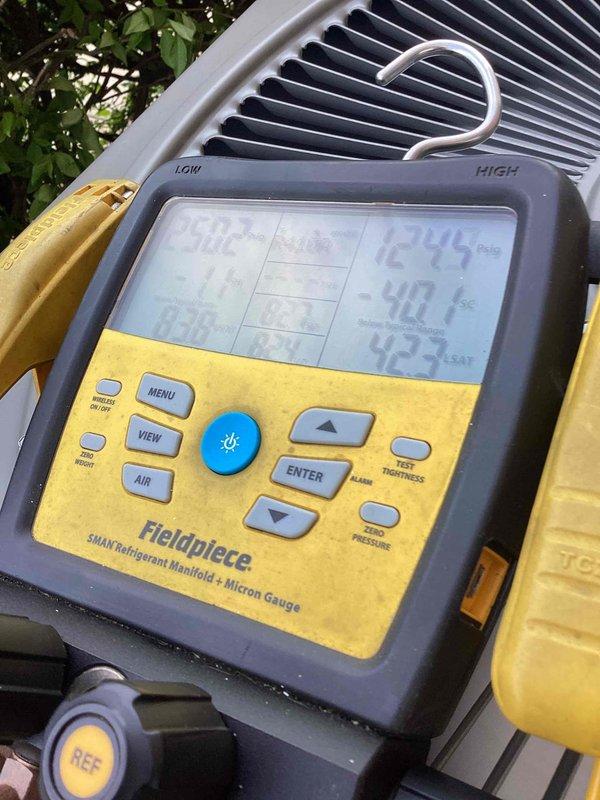 Completed comprehensive cooling tune-up on 13-year-old ground-mounted AC condenser unit. Performed standard maintenance protocol including refrigerant pressure and temperature diagnostics using digital manifold gauges, verified system operating parameters within manufacturer specifications, and documented unit condition with photographic records. All components inspected and system confirmed operational for continued cooling season performance.