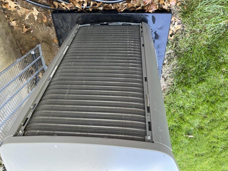 Completed comprehensive tune-up maintenance on a 3-year-old outdoor air conditioning unit per Home Depot service agreement. Performed standard preventive maintenance procedures including inspection of condenser coils, fan operation, electrical connections, and refrigerant levels. Unit found in normal operating condition with typical debris accumulation between coil fins; cleaned and restored system to optimal performance specifications.