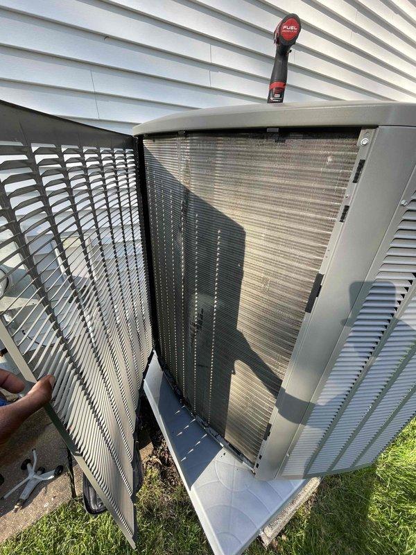 Performed comprehensive cooling system tune-up on outdoor condensing unit located in side yard. Conducted electrical diagnostics using clamp meter, measuring amperage draw of 49 amps on compressor circuit, and inspected all wire connections at terminal block. Removed access panels to examine condenser coils and internal components, verified proper operation of all electrical connections, and completed standard maintenance procedures on unit under 10 years old per Home Depot service agreement specifications.