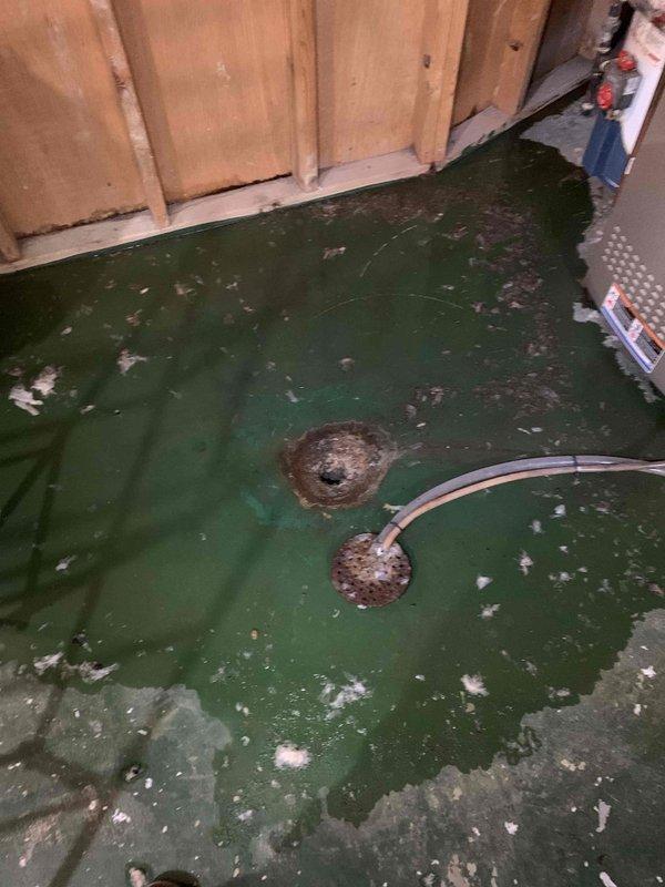 Responded to main drain cleanout service requiring cable access from roof with two-technician crew as specified. Upon arrival, accessed main drainage system through roof entry point and assessed condition of vertical waste pipe showing significant corrosion and deterioration. Performed cable cleanout procedure on main line to clear obstruction and restore proper drainage flow. Documented existing infrastructure conditions including heavily corroded vertical drain pipe with rusted fittings and deteriorated floor drains in basement utility area. Work completed as scheduled return visit coordinating with previous service request. Additional repairs will be required to address corroded piping and compromised drainage system components identified during service.