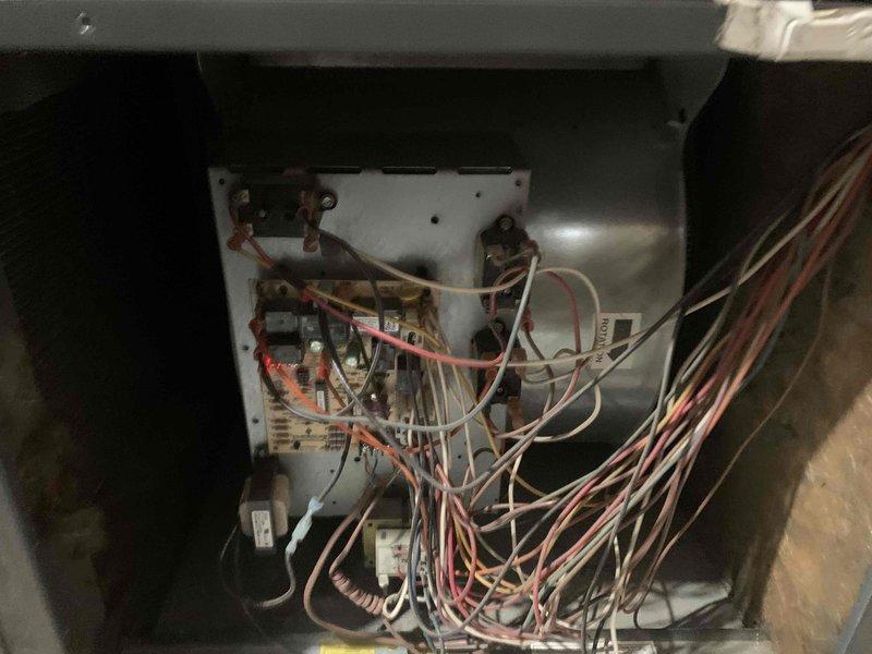 Completed comprehensive cooling season tune-up maintenance on two residential air conditioning systems: a 17-year-old unit and a 6-year-old unit, both with ground-level exterior condensers. Performed standard preventive maintenance procedures including inspection of electrical components, control boards, and wiring connections on both systems. Documented heavily soiled air filter requiring replacement due to significant dust and debris accumulation that would restrict airflow and reduce system efficiency. Inspected internal mechanical components, verified proper operation of contactors and relays, and assessed overall system condition through visual examination and photographic documentation.