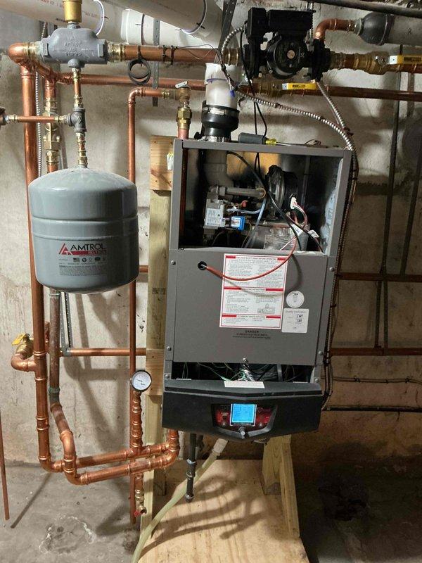 Completed comprehensive supertune maintenance on two 10-year-old HVAC systems. Performed full system inspection on indoor boiler unit including cleaning and testing of internal components, circuit boards, and electrical connections; verified proper operation of expansion tank, circulator pump, and pressure relief systems; inspected and tested all copper piping connections and fittings for leaks. Serviced outdoor condensing unit including cleaning of coils, testing capacitor and contactor connections, and verifying proper electrical connections at terminal block. Both systems tested and operating within manufacturer specifications upon completion.