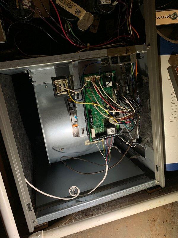 Completed comprehensive tune-up service on two residential air conditioning systems, including a 3-year-old unit and a 10-year-old unit, both with ground-level outdoor condenser placements. Performed standard maintenance procedures on both systems, including inspection of electrical controls, blower motor components, and control boards with associated wiring connections. During inspection of the older unit, identified significant frost accumulation on evaporator coil assembly indicating restricted airflow or potential refrigerant system issues requiring attention. Documented internal components including control panels, refrigerant line connections, and coil conditions through photographic records. Customer enrolled in preventive maintenance agreement plan during the service visit.