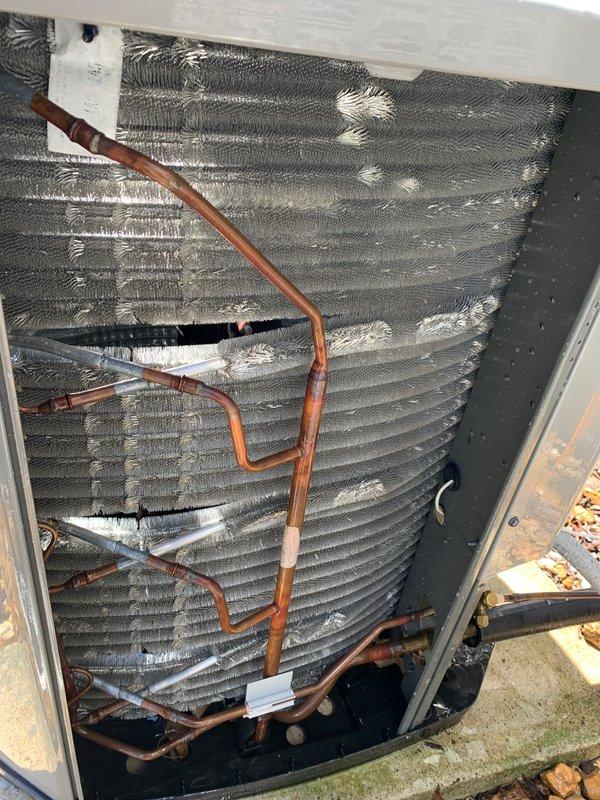 Completed comprehensive tune-up service on two residential air conditioning systems, including a 3-year-old unit and a 10-year-old unit, both with ground-level outdoor condenser placements. Performed standard maintenance procedures on both systems, including inspection of electrical controls, blower motor components, and control boards with associated wiring connections. During inspection of the older unit, identified significant frost accumulation on evaporator coil assembly indicating restricted airflow or potential refrigerant system issues requiring attention. Documented internal components including control panels, refrigerant line connections, and coil conditions through photographic records. Customer enrolled in preventive maintenance agreement plan during the service visit.