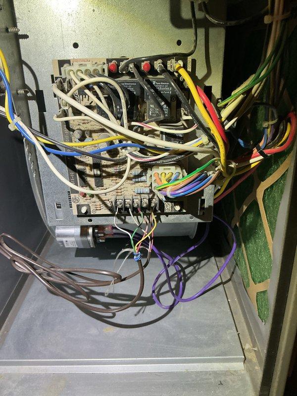 Responded to no-cool service call for residential AC unit. Upon arrival, inspected electrical control panel and found disorganized wiring with multiple relay modules and contactors. Verified all electrical connections, tested control circuitry, and checked safety circuits. Inspected air handler and found dirty air filter restricting airflow. Replaced filter with new EZ Flow unit. Tested system operation and confirmed AC unit restored to normal cooling function.