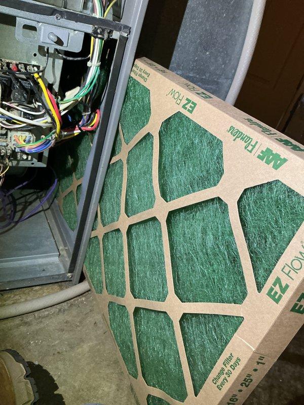 Responded to no-cool service call for residential AC unit. Upon arrival, inspected electrical control panel and found disorganized wiring with multiple relay modules and contactors. Verified all electrical connections, tested control circuitry, and checked safety circuits. Inspected air handler and found dirty air filter restricting airflow. Replaced filter with new EZ Flow unit. Tested system operation and confirmed AC unit restored to normal cooling function.