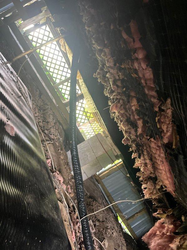 Replaced refrigerant line set for HVAC system requiring access to crawl space beneath home. Deployed protective tarps due to wet conditions under structure before performing work. Documented existing conditions showing deteriorated insulation, accumulated debris, and contaminated air handler components with significant biological growth and material buildup on coils and interior surfaces. Line set replacement completed as warranty work related to original installation.