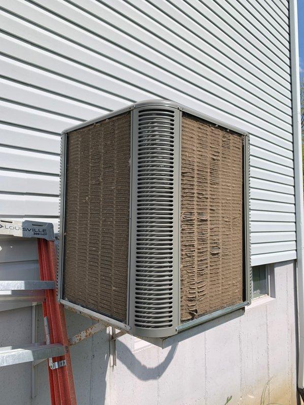 Completed seasonal cooling tune-up on 2-year-old residential air conditioning system located on exterior pad. Performed comprehensive inspection of condenser unit, noting significant dirt and debris accumulation on exterior surfaces and coils; cleaned and serviced unit to restore optimal airflow and efficiency. Inspected all electrical components, control board, capacitor, and wiring connections inside unit; verified proper operation of all systems and confirmed unit is functioning within manufacturer specifications.