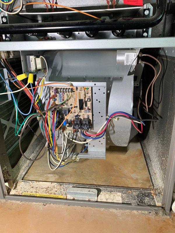 Completed seasonal cooling tune-up on 2-year-old residential air conditioning system located on exterior pad. Performed comprehensive inspection of condenser unit, noting significant dirt and debris accumulation on exterior surfaces and coils; cleaned and serviced unit to restore optimal airflow and efficiency. Inspected all electrical components, control board, capacitor, and wiring connections inside unit; verified proper operation of all systems and confirmed unit is functioning within manufacturer specifications.