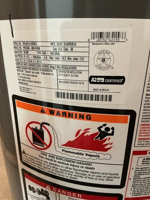 Successfully installed a 50-gallon tall natural gas water heater in basement location, replacing a 12-year-old unit that showed significant corrosion and deterioration on pipe fittings and connections. Removed existing water heater and installed new unit with proper venting, gas line connections, and water supply lines per manufacturer specifications and local plumbing code requirements. Applied required plumbing identification sticker and obtained permit approval for installation to ensure compliance with municipal regulations.