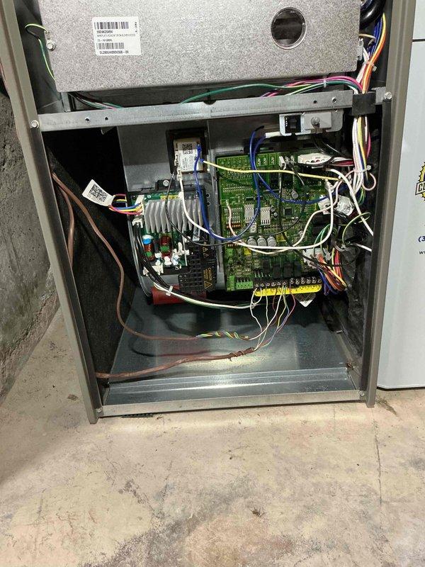 # HVAC Cooling System Tune-Up Completed

Performed comprehensive preventive maintenance tune-up on a one-year-old residential air conditioning unit located in the backyard. Conducted thorough inspection of the system's control cabinet, accessing internal electronic components including circuit boards, pressure switches, and wiring connections. Verified proper operation of all control sequences and safety devices within the furnace panel.

Utilized digital multimeter to perform electrical diagnostics, measuring voltage and amperage readings to ensure system is operating within manufacturer specifications. All electrical measurements fell within acceptable parameters. Inspected wire connections, securing loose wiring with appropriate fasteners and verifying all terminations were tight and secure.

Examined control board components, capacitors, and integrated circuits for signs of wear or damage. All electronic components showed normal operation with no visible defects. Pressure switch an