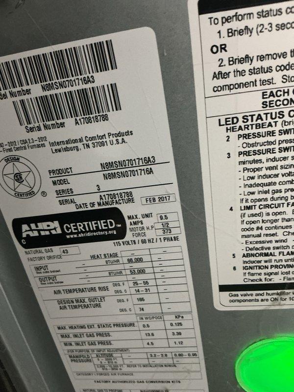 Completed seasonal cooling maintenance on single residential HVAC unit located at side of house. Performed comprehensive tune-up inspection including control board examination, verified electrical connections, and documented equipment specifications. Unit is an International Comfort Products system manufactured February 2017, model NSMSNGTGT1GA3, with 96,000 BTU/HR capacity operating on 115V/60Hz/1-phase power. Noted evidence of heat stress on control board terminal block connections and documented current system condition through photographic records for maintenance history.
