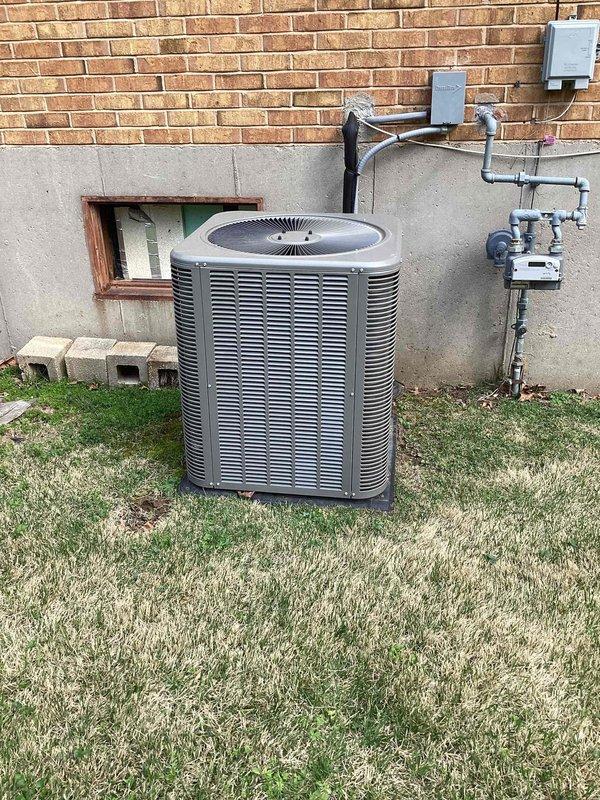 Responded to no cooling complaint on residential air conditioning system located in side yard. Upon arrival, found unit blowing warm air as reported. Performed diagnostic inspection and identified failed dual-run capacitor. Replaced defective capacitor with new component, restored proper electrical connections, and verified system operation. Unit tested successfully with proper cooling function restored.