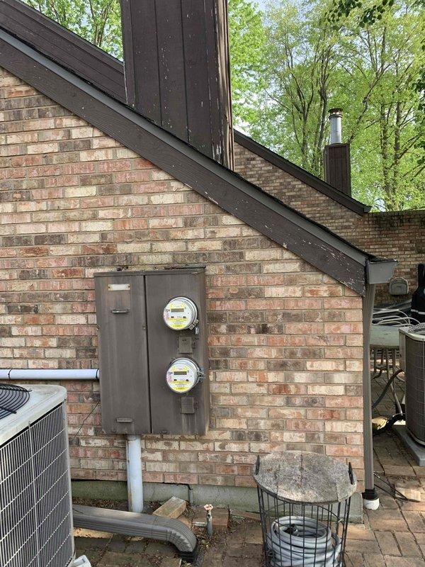 Completed comprehensive electrical safety inspection of residential property. Evaluated main electrical service panel with dual meter configuration, exterior GFCI-protected 30-amp air conditioner disconnect outlet showing weathering and corrosion on enclosure, and overall electrical system integrity. Documented findings with photographic evidence for homeowner records and recommended maintenance considerations based on observed exterior electrical component conditions.