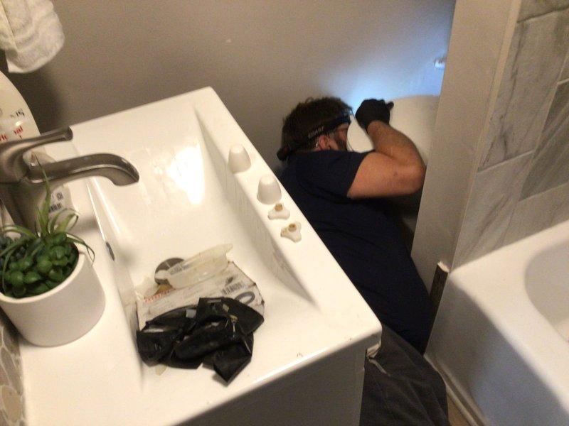 Responded to recurring toilet backup issue in bathroom. Deployed two-person crew to access and cable toilet fixture directly in tight space configuration. Previous roof access attempts had not resolved the stoppage. Successfully performed mechanical cabling of toilet drain line to clear obstruction and restore proper drainage function.